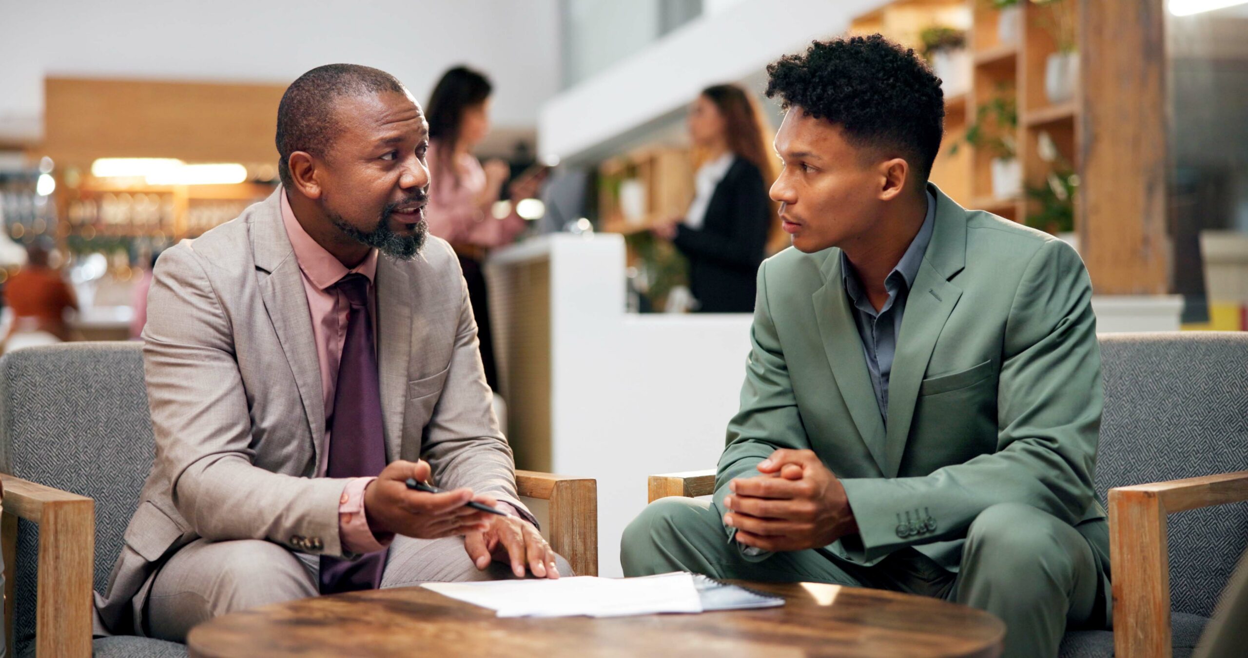 Two business professionals in a career mentorship session.